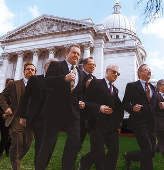 Loosed from their chambers, lawmakers surge down Capitol Hill
toward a crowd of thrill-seekers in Monday's 83rd annual Running Of The
Congressmen.